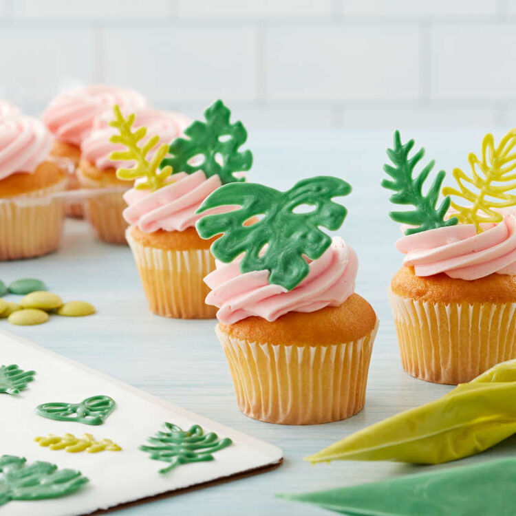 Candy Melt piped leaves atop cupcakes