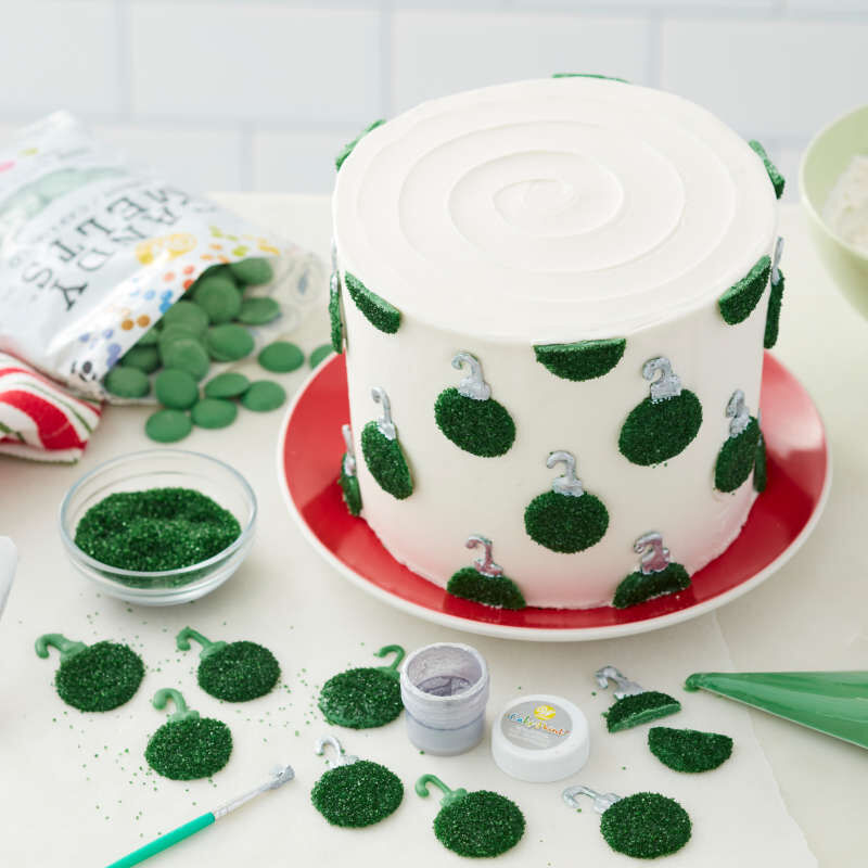 Green Candy Melt wafers covered in green sparkling sugar and attached to a cake to look like ornaments image number 5