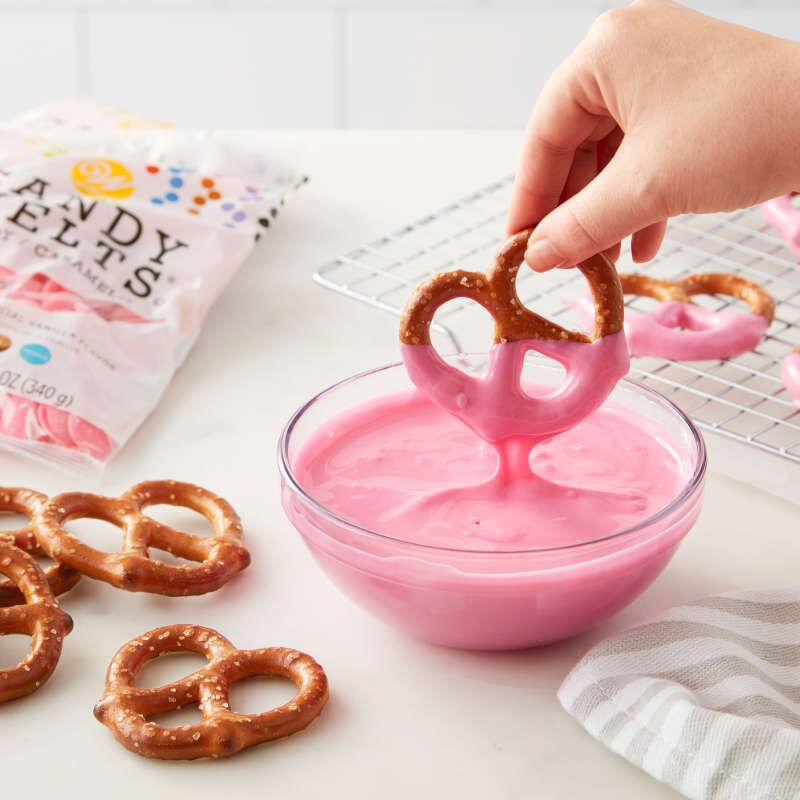 Pretzel dipped in light pink Candy Melts image number 3