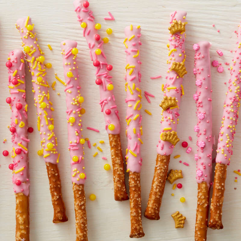 Light pink Candy Melt dipped pretzel rods image number 4