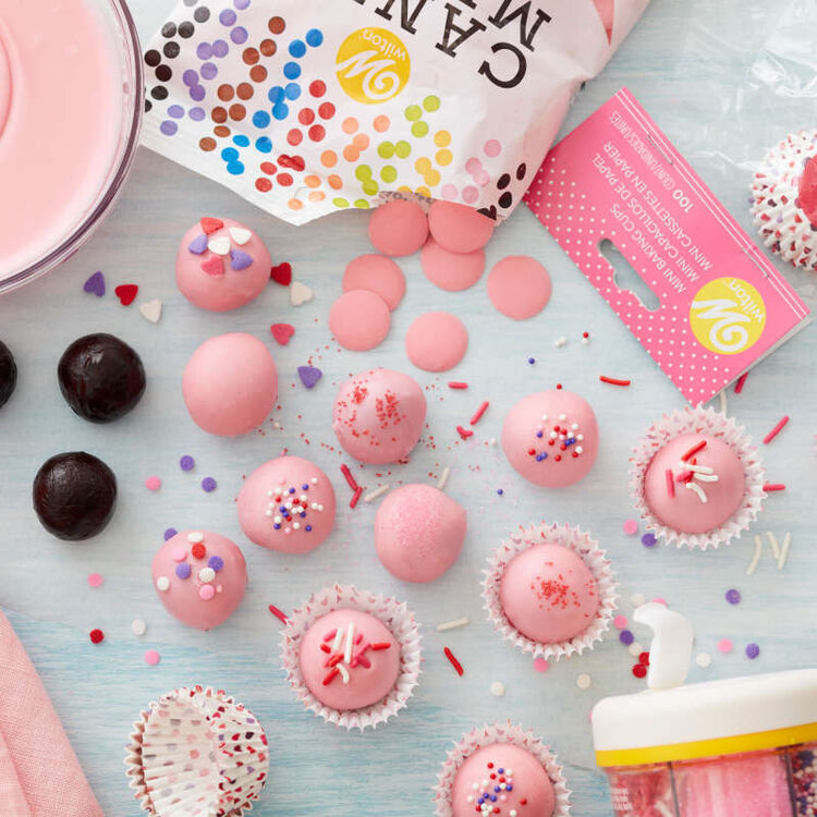 Light pink Candy Melt-covered hot chocolate bombs