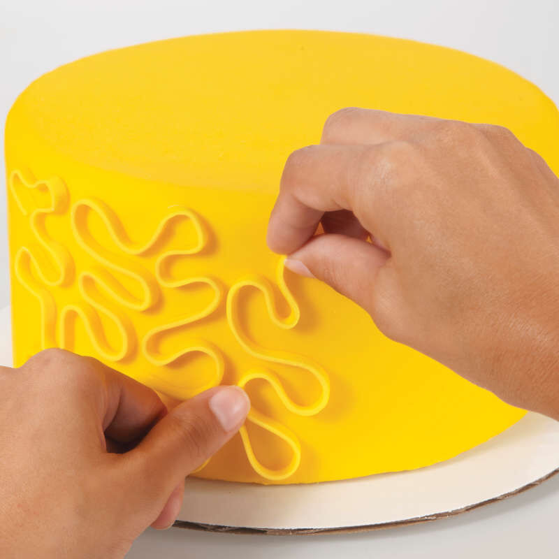Decorating a Yellow Fondant Cake image number 3