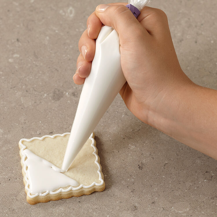 How to cover a cookie with cookie icing