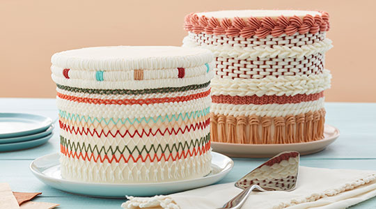 Cakes with piped buttercream that looks like woven yarn